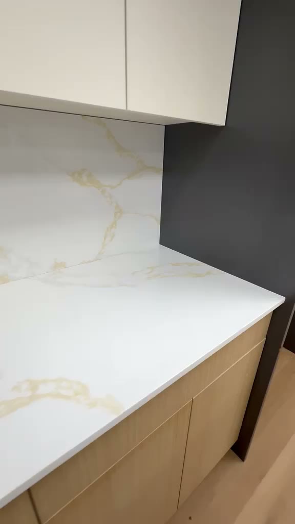 Video walkthrough of an office kitchen with a stone island