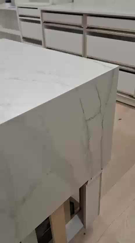 Video tour of a kitchen with a white Dekton island