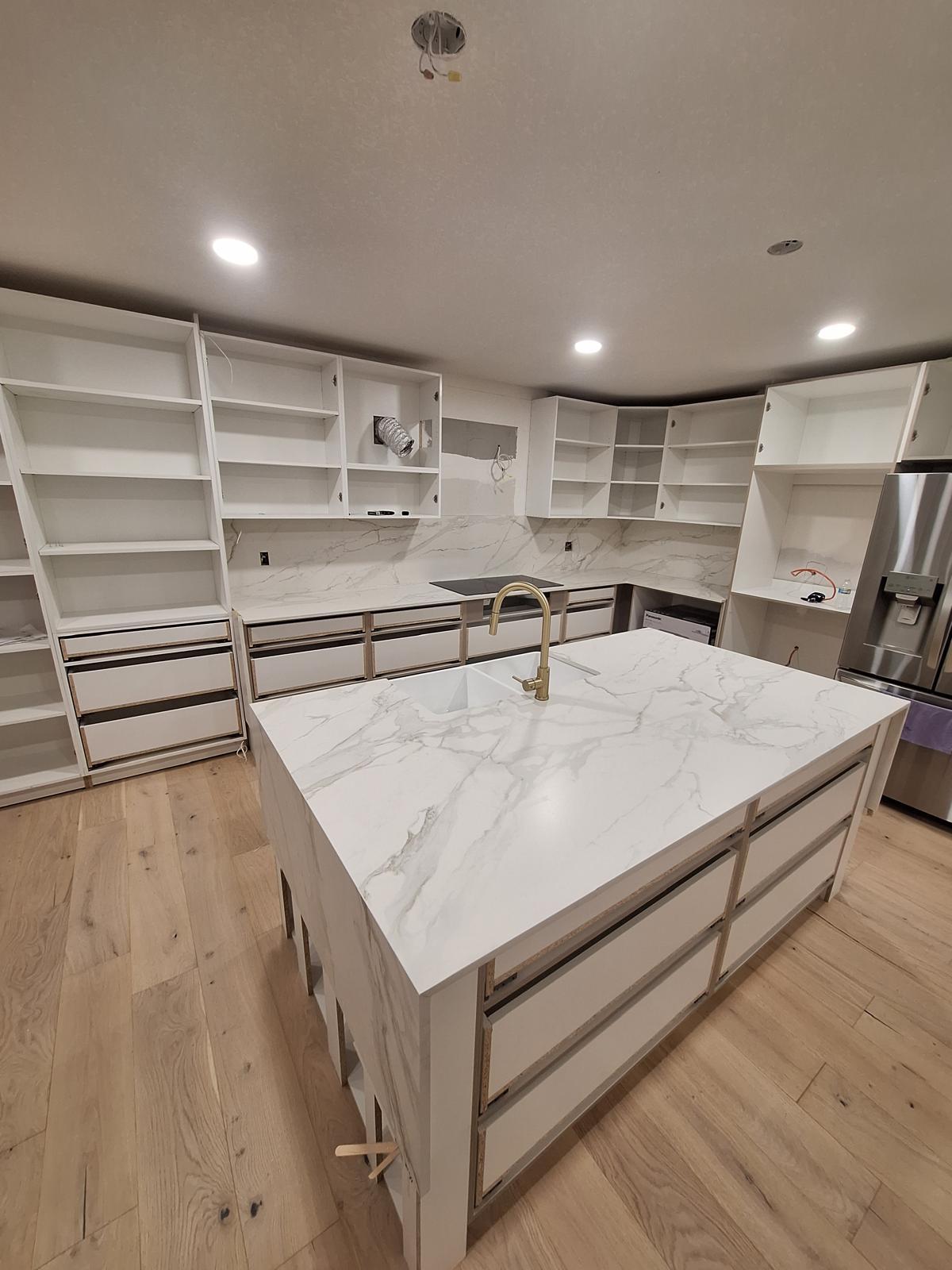 Angled view of a white Dekton kitchen island