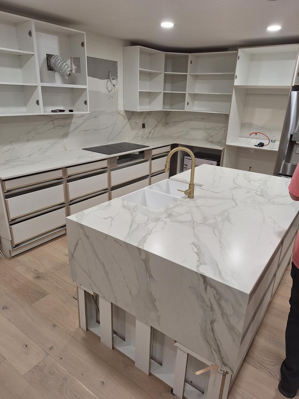 Detail view of a white Dekton kitchen island