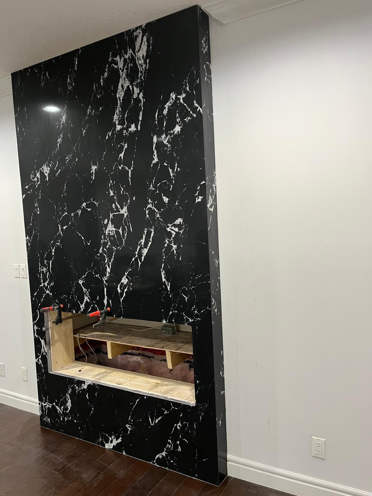 Side view of a black marble fireplace feature wall