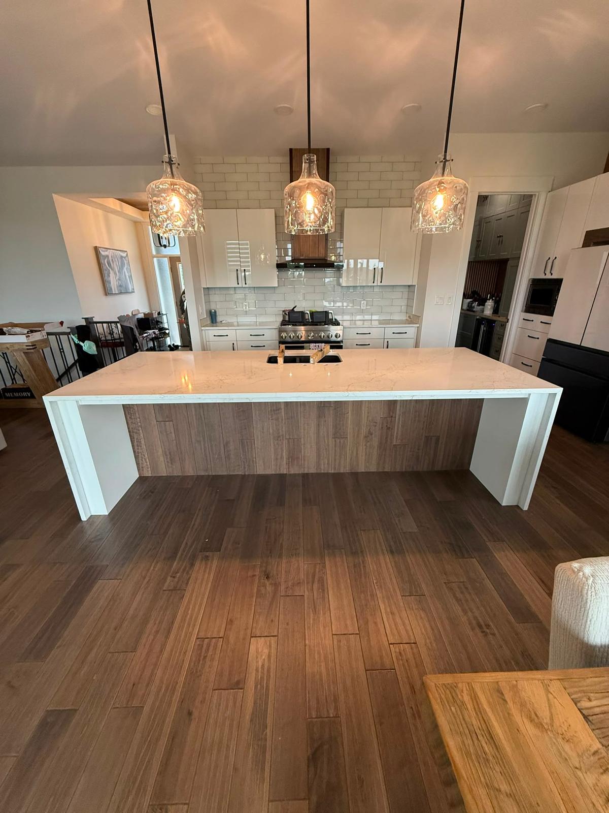 Kitchen with a large white quartz island