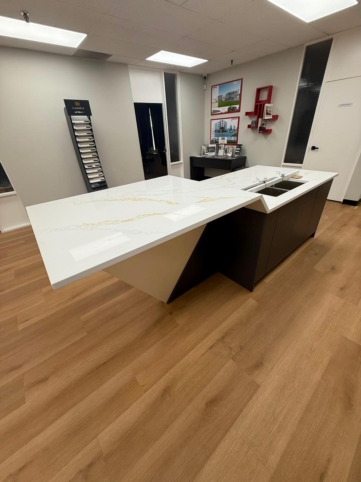 Office kitchen with a stone island