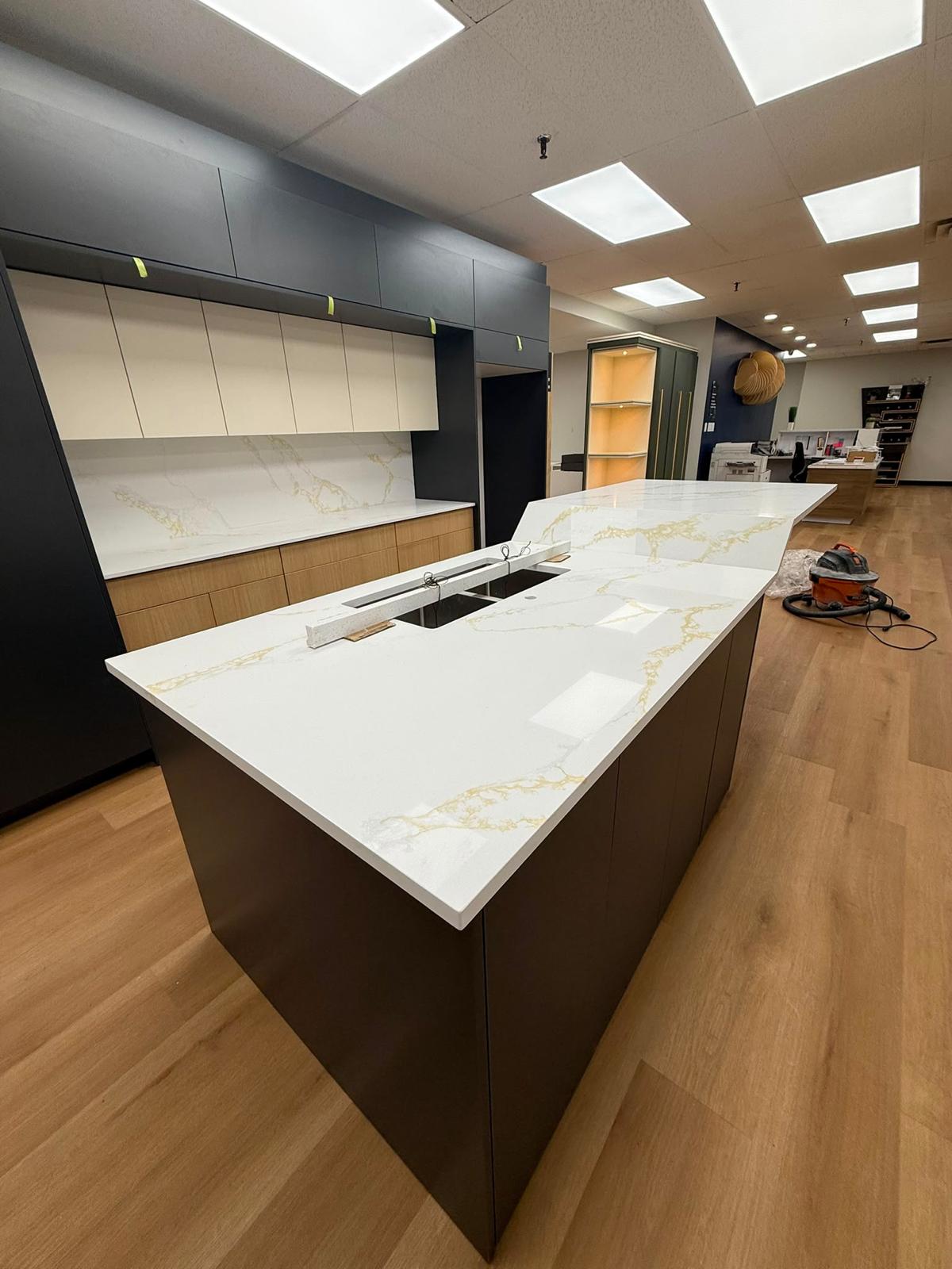 Opposite side view of an office kitchen stone island
