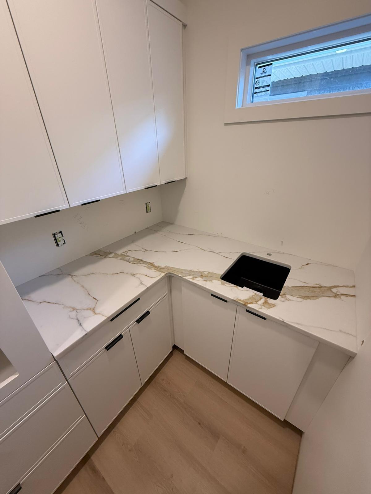 Compact kitchen with stone countertops