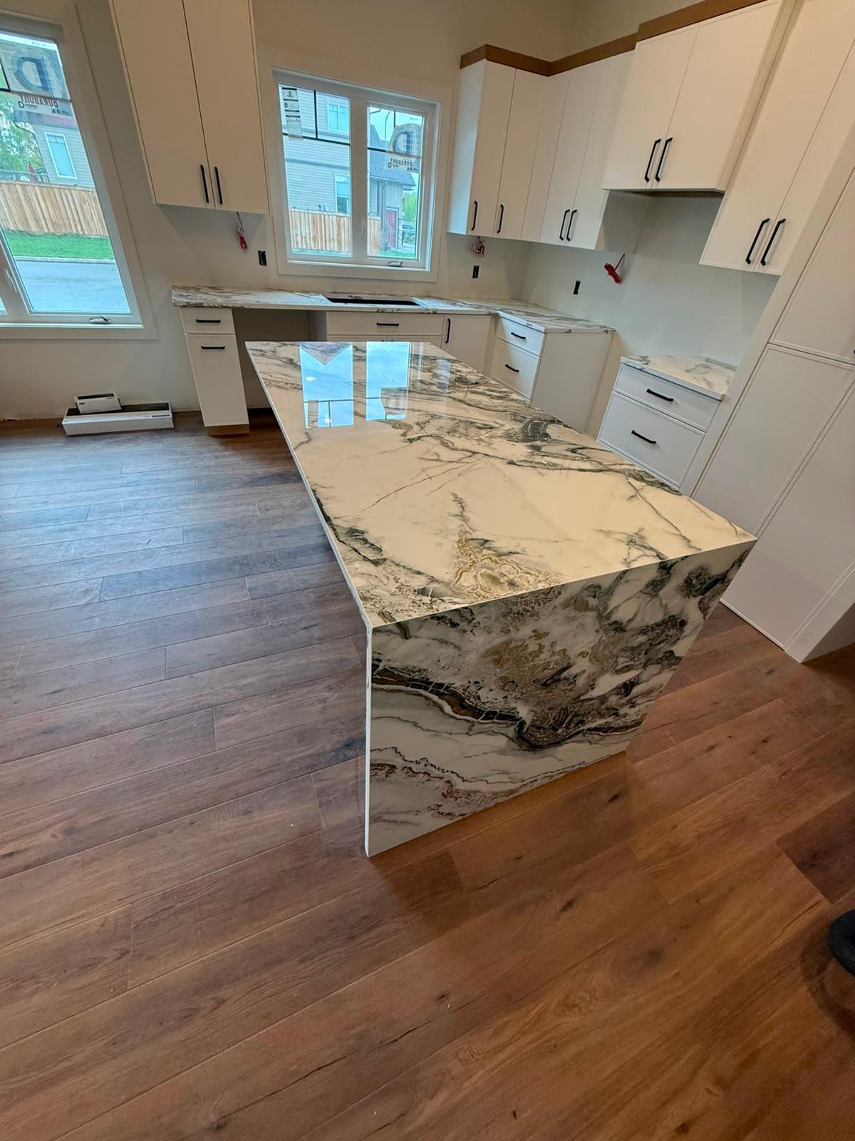 Kitchen with a black and white stone island