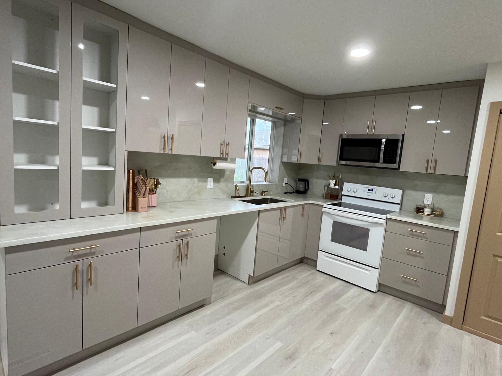 Full kitchen with stone countertops and backsplash