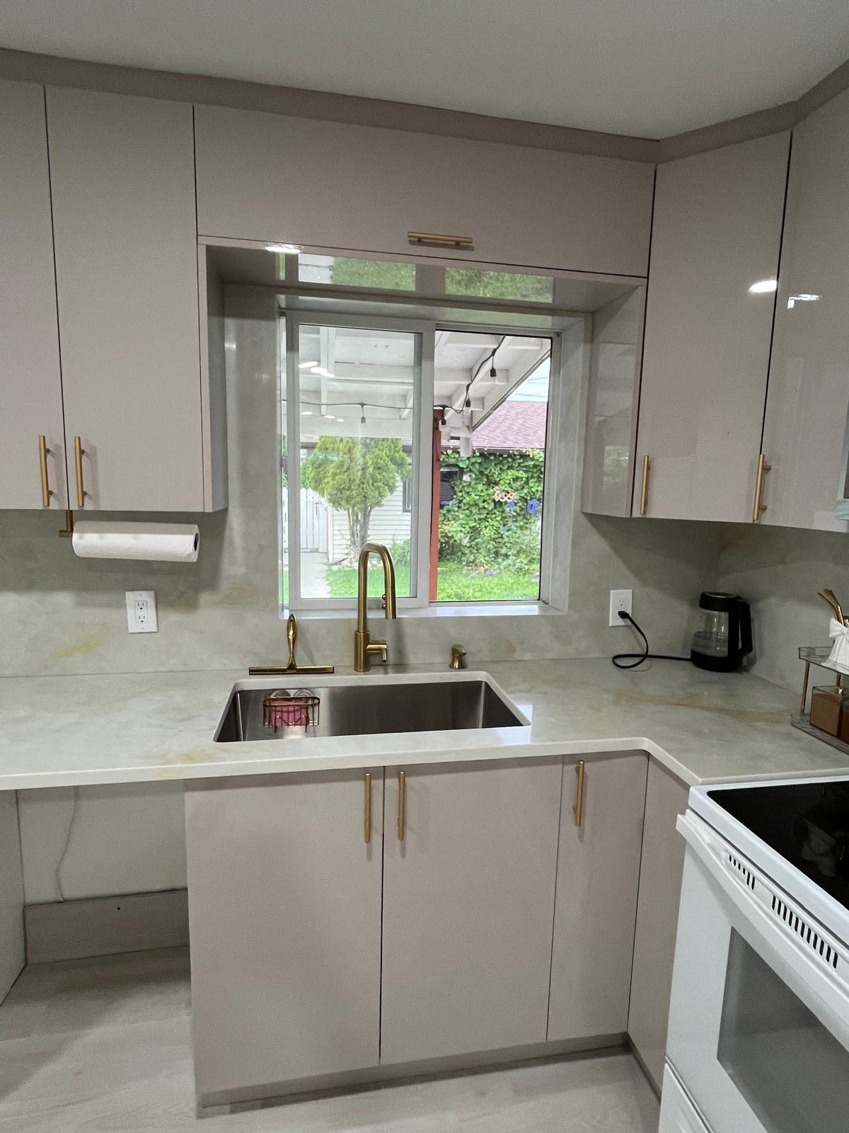 Kitchen sink with a full stone backsplash