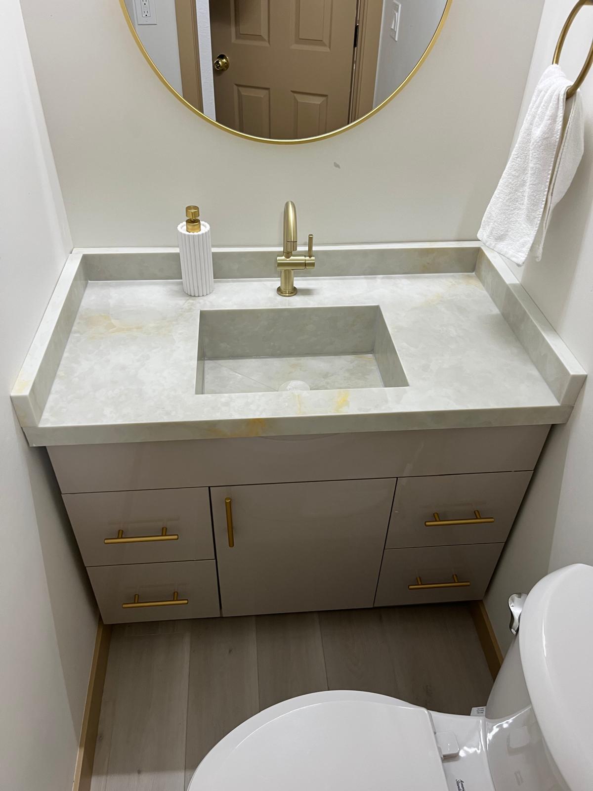 Guest bathroom vanity with stone countertop