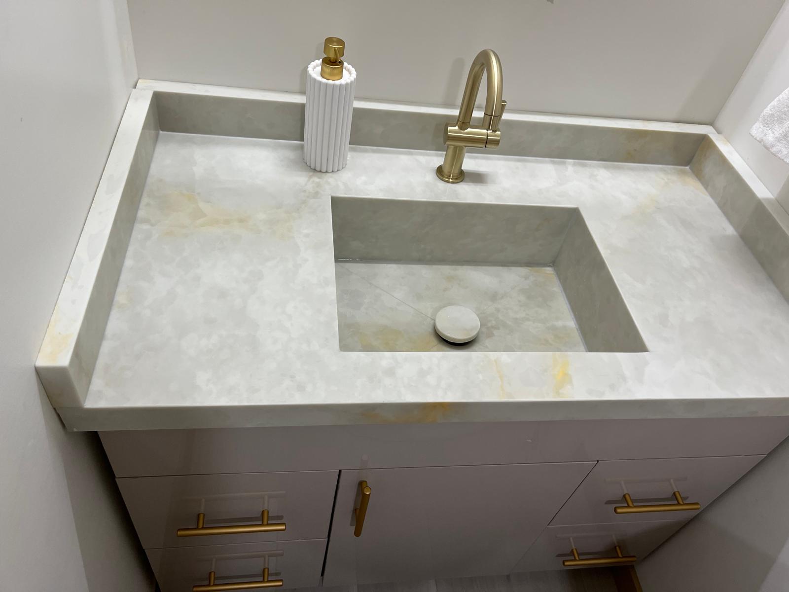 Close-up of a guest bathroom stone vanity
