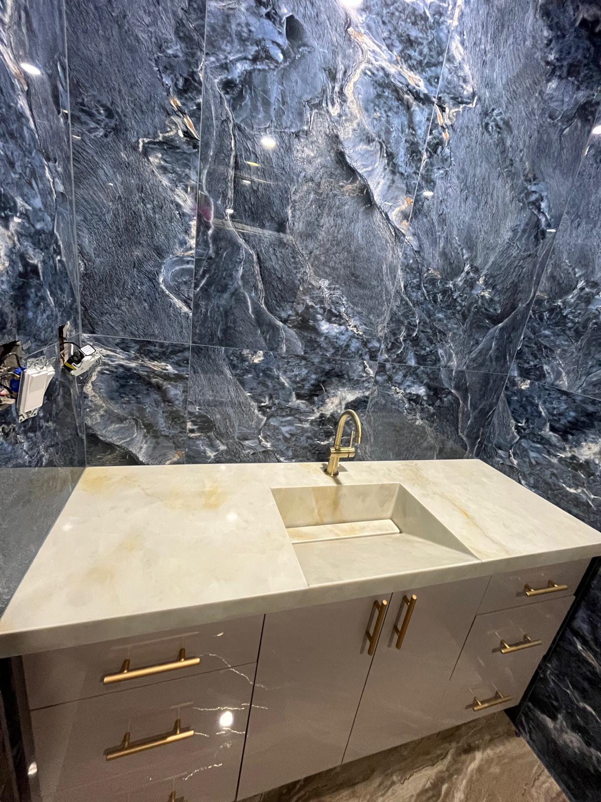 Angled view of a master bathroom stone vanity
