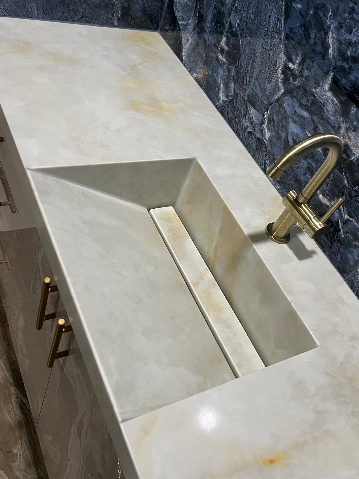 Right sink of a master bathroom stone vanity